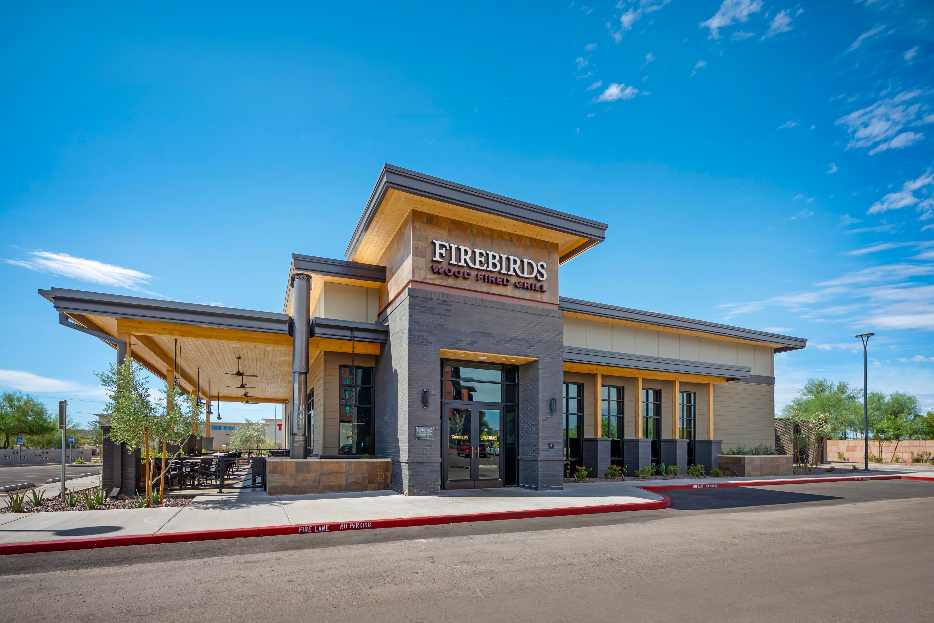 Firebirds Wood Fired Grill exterior and patio at Norterra